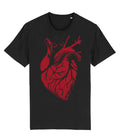A black short-sleeve crewneck t-shirt featuring a large, distressed red anatomical heart graphic on the front, displayed against a solid white background.